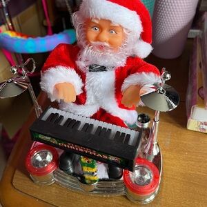 Santa playing  Christmas music battery operated (AA ) not included